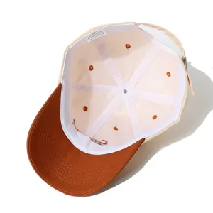 Detailed view of inner lining and cotton material of the stylish color-block baseball cap.