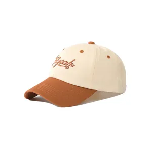 Detailed view of the two-tone embroidered baseball cap featuring contrast brim and eyelets.