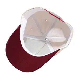 Interior detail view of a five-panel color-block trucker cap, showing neat inner seams.