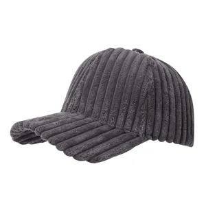 Thick corduroy baseball cap detail view, dark gray color, soft textured fabric, casual autumn style.