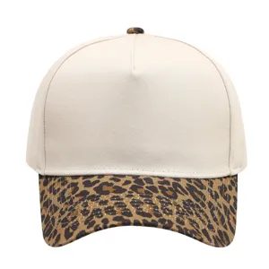 Detail view of baseball cap featuring leopard print brim and beige crown texture.