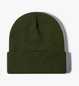 Detailed view of the solid army green knit cuffed beanie close-up texture warm winter cap.