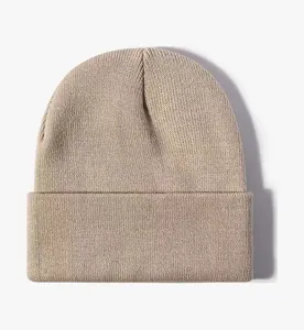 Close-up detail view of the solid color knit beanie, soft textured winter warm cuffed cap.