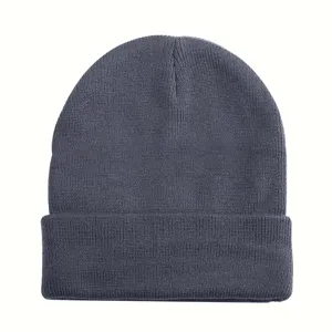 Close-up of dark grey knitted beanie, showing soft wool texture and rolled edge detail.