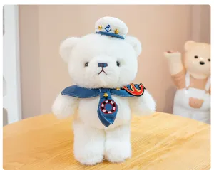 Close-up detail of the cute white plush sailor bear with detailed hat, anchor collar.
