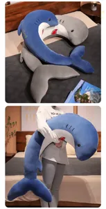 Soft long shark plush body pillow detail showing cozy bedroom scene and soft fabric texture.