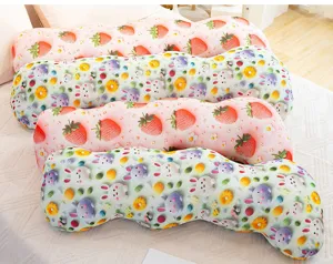 Detail shot of long body pillows with cute strawberry and bunny print for side sleeping comfort.