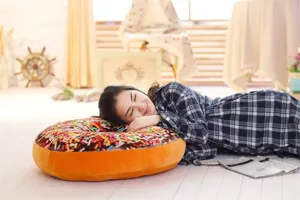 Large chocolate donut plush pillow, ultra-soft cushion for office nap and home cozy decor.