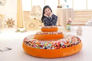 Giant soft plush donut pillow with chocolate sprinkles, cozy cushion for office homedecor.