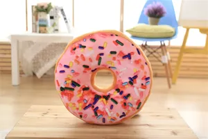 Soft plush donut pillow with colorful sprinkles, perfect cushion for office nap and home decor.