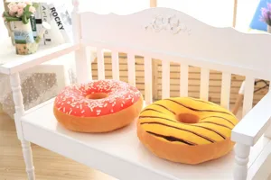 Soft plush donut throw pillow detail, cute food shape cushion for home office decor.