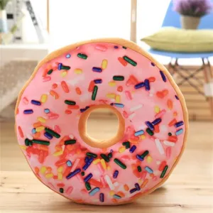 Soft plush donut throw pillow with colorful sprinkle print, cozy home decoration detail.