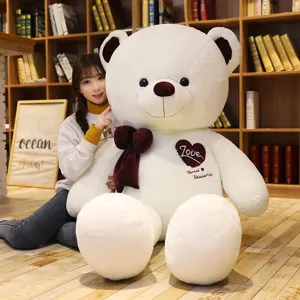 Large giant teddy bear plush toy with big bow and heart embroidery for hugging and gifts.