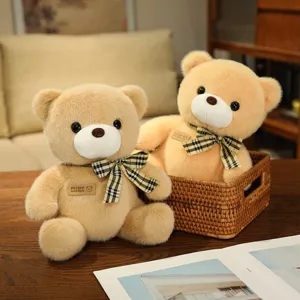 Cute plush teddy bear stuffed animal toy with plaid bow tie for kids gifts and cozy home decor.