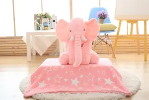 Close-up detail shot of the cute pink elephant plush toy on a soft star blanket.