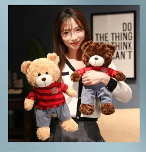 Cute small teddy bear plush toy with sweater and pants, soft hugging doll for kids bed.