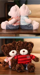 Close-up details of cute plush teddy bear toys wearing cozy striped sweaters on wooden table.
