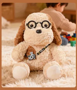 Cute plush dog toy with black glasses and mini camera pendant, soft stuffed animal gift.