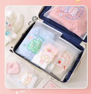 Frosted zipper storage bags for clothes packing, waterproof travel organizers with cute prints.
