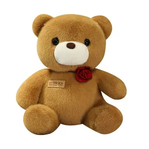 Cute sitting teddy bear plush toy with rose, soft stuffed animal doll for girls and kids.