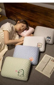 Cooling bean nap pillow for students and kids, soft tactile touch for comfortable sleeping.