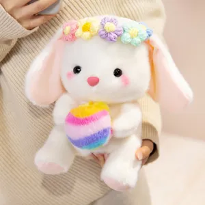 Cute white bunny plush toy with floral crown holding colorful ball, sweet gift for girls.