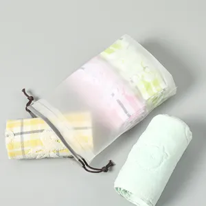 Frosted PE drawstring storage bag with plaid and solid color towels for travel home.