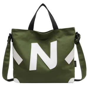 Large capacity green canvas tote bag with white N logo, casual shoulder crossbody bag for women.