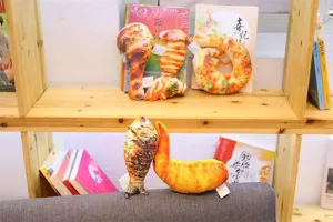 Detailed view of realistic food plush toys displayed on wooden shelves, soft and funny.