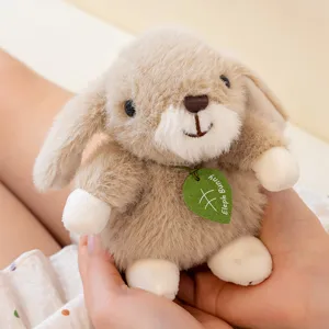 Cute brown bunny plush toy pendant, soft stuffed animal doll for car decor or keyring gift.