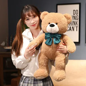 Simpatico orsetto di peluche marrone con fiocco verde scuro morbida bambola cuscino regalo per ragazze.