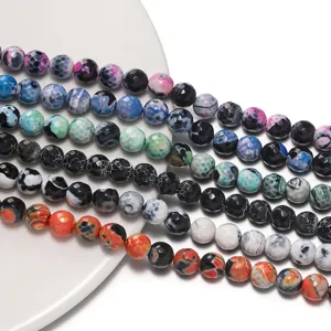 Close-up detail view of colorful faceted fire agate loose beads for DIY jewelry making.