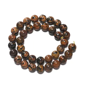 Detailed shot of polished peacock obsidian round beads strand, perfect for DIY jewelry making.