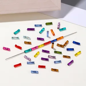 Colorful glass twisted tube beads for DIY bracelets, shining cylindrical craft materials detail shot