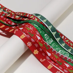 Detailed close-up of Christmas printed grosgrain ribbons featuring festive patterns and text.