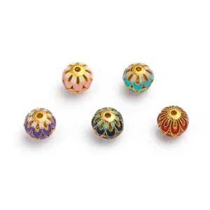 Detailed view of vintage cloisonne enamel flower beads, gold plated DIY jewelry making accessories.