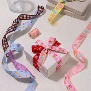 Detailed view of cartoon printed grosgrain ribbon featuring cute flower and candy patterns for gifts.