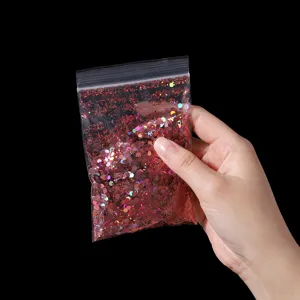 Red hexagonal nail glitter flakes holographic sequin powder for DIY nail art decoration.