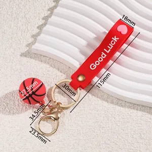 Mini basketball keychain with Good Luck strap, metal ring, stylish bag pendant accessory.