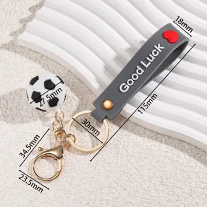 World Cup theme mini soccer ball keychain with grey silicone strap, metal ring and clasp.