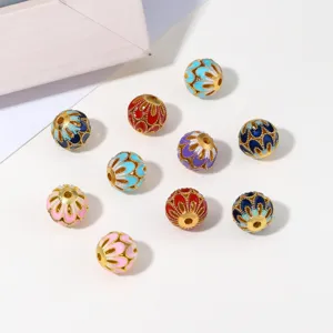 Close-up of colorful enamel filigree beads, vintage metallic DIY jewelry accessories.