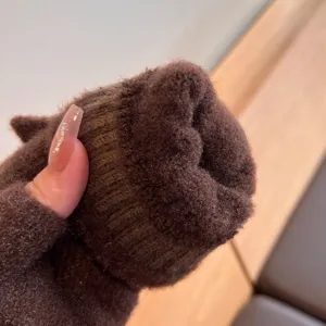 Detailed view of the plush warm knitted winter gloves, showcasing soft inner lining.
