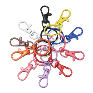 Colorful alloy lobster clasps and split rings for DIY bag charms and doll accessories.