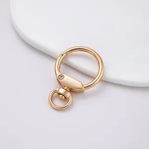 Mosquetón redondo dorado de aleación de zinc para accesorios de bolsos y manualidades DIY.