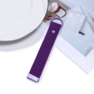 Detailed close-up view of the purple woven keychain strap, showing the metal ring and snap.