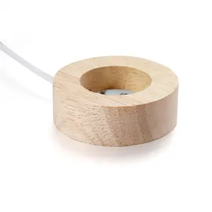 Détail du socle lumineux en bois LED, support d'affichage rond lumineux pour boule de cristal.