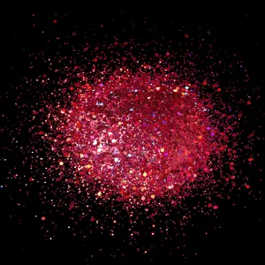 Detailed close-up of red laser nail glitter powder, sparkling hexagonal sequins for DIY.
