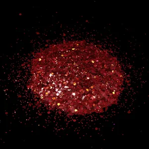 Red hexagonal nail art glitter sequins cosmetic flash powder detail close up view
