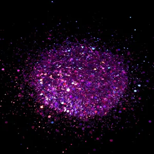 Closeup macro shot of purple hexagonal nail glitter flakes showing shimmering sparkle texture.