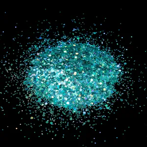 Teal hexagonal nail glitter flakes detail shot, sparkling holographic craft powder display.